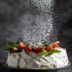 Powdered sugar decorates Pavlova's dessert