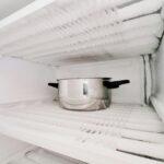 Defrost the freezer and refrigerator. Housekeeping, home keeping, house work, ice and frost, kitchen