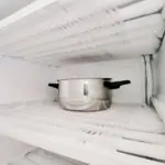 Defrost the freezer and refrigerator. Housekeeping, home keeping, house work, ice and frost, kitchen