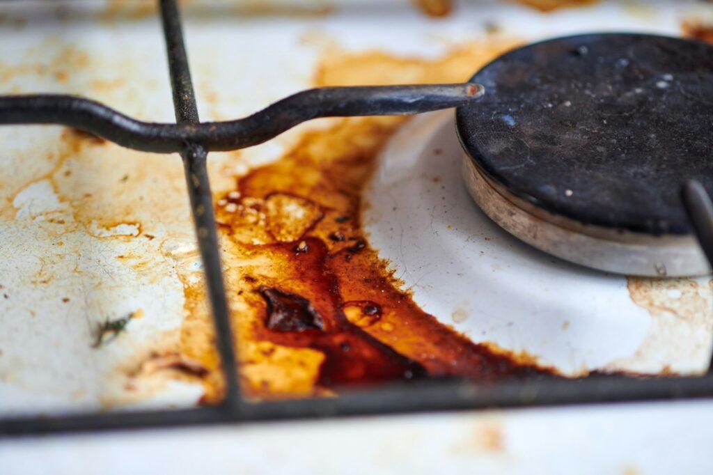 Dirty stove with food leftovers
