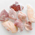 Frozen meat in cling film or plastic wrap.