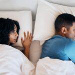Frustrated couple, fight and lying in bed conflict, divorce or argument from disagreement or disput