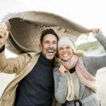 Portrait of happy couple on beach