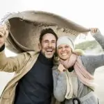 Portrait of happy couple on beach