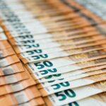 Selective focus of euro banknotes on table. Money, currency, cash, banking, finance.