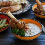 Lamb shank with puree and parsley in bowl