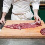 Butcher preparing beef tenderloin