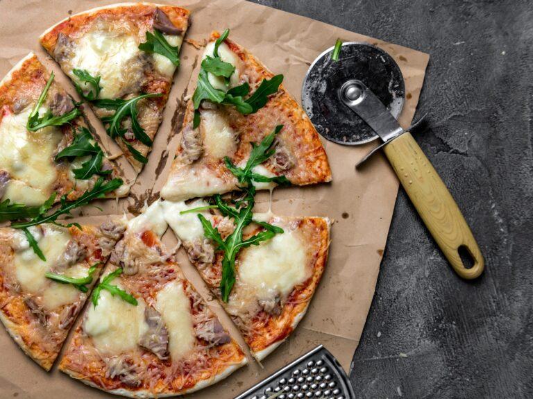 homemade pizza with tuna, mozzarella cheese, parmesan and rucola
