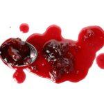 Tasty cherry jam isolated on white background