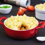 Homemade shepherd's pie on wooden background